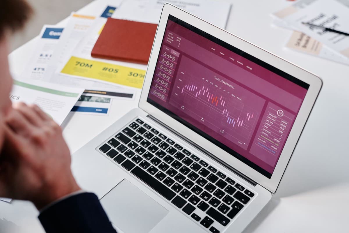 A person reviewing an analytics dashboard on a laptop
