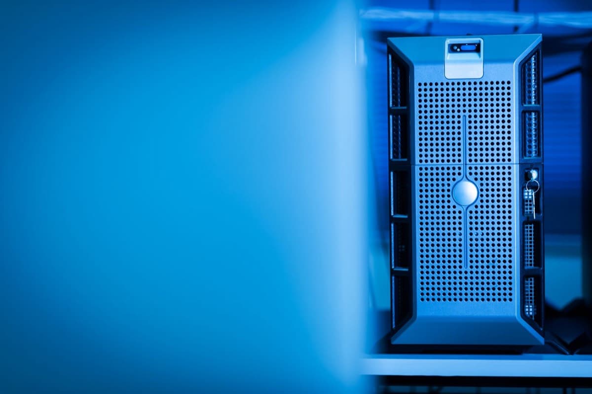 A server lit in blue inside a data centre